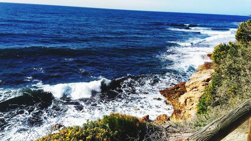 Scenic view of sea against blue sky