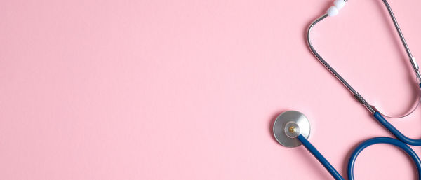 High angle view of pink umbrella against white background