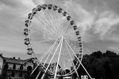 Low angle view of ferris wheel against sky