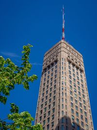 Low angle view of building against blue sky