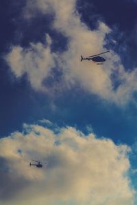 Low angle view of airplane flying in sky