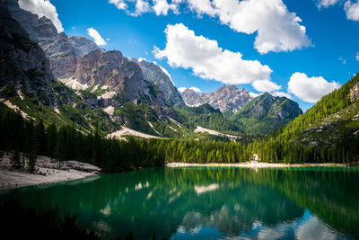 Scenic view of lake and mountains against sky