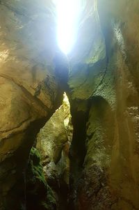 Low angle view of rock formation against sky