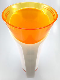 Close-up of drink on table against white background