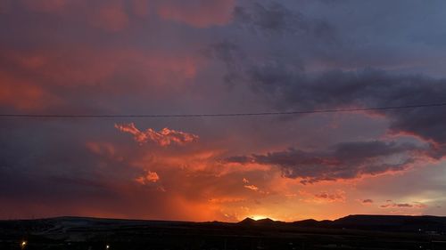 Scenic view of dramatic sky during sunset