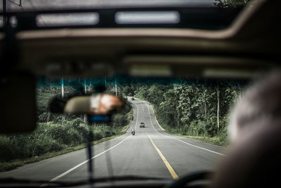 Road seen through car windshield