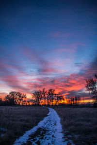 Scenic view of landscape against sky during winter