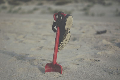 Close-up of toy on sand