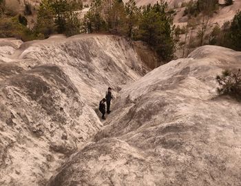 High angle view of man surfing on rock