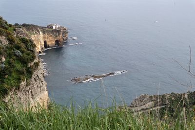 High angle view of rocks by sea