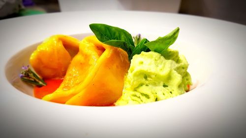 Close-up of fruits in plate on table