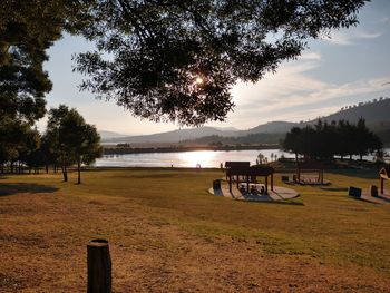 Scenic view of lake against sky during sunset