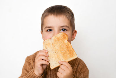 Children and gluten. preschool boy with toasted bread. gluten intolerance by kids. 