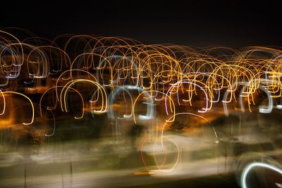 Light trails against sky at night