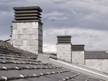 Low angle view of building against cloudy sky