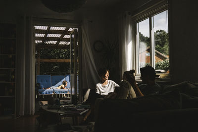 People sitting on table by window