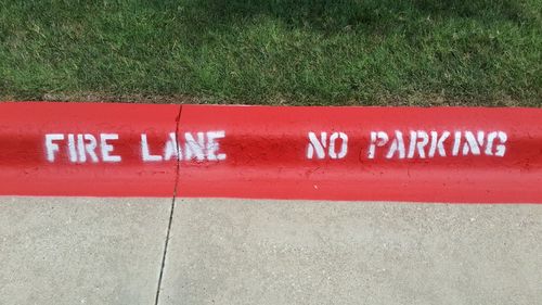 Close-up of text on grass