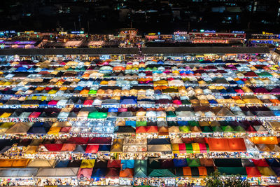 High angle view of illuminated buildings in city at night