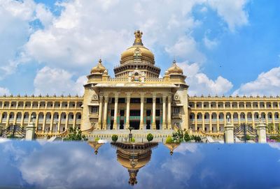 Low angle view of building against cloudy sky