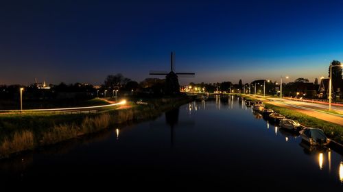 Reflection of illuminated buildings in water at night