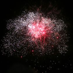 Close-up of firework display against sky at night