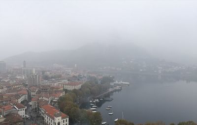 High angle view of cityscape against sky during foggy weather