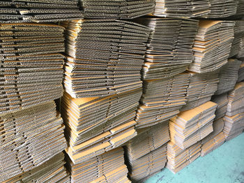 Cardboard sheets stacked in warehouse