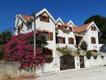 Houses against clear blue sky