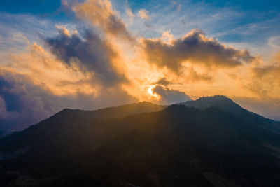 Scenic view of mountains against sky during sunset