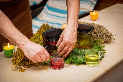 Midsection of man preparing food on table