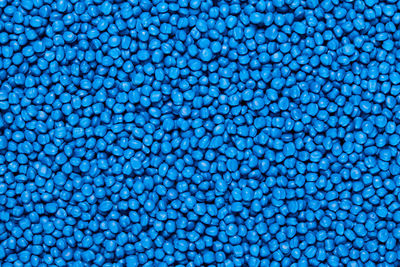 Full frame shot blue polymer granules