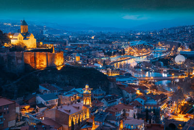 High angle view of illuminated cityscape at night