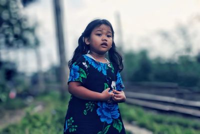 Portrait of young woman using mobile phone