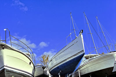 Low angle view of bridge against blue sky