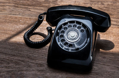 High angle view of telephone on table