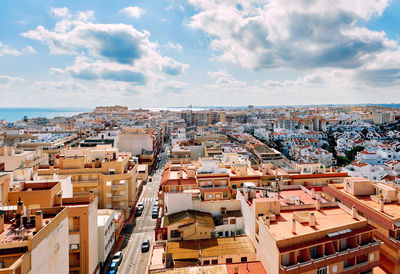 Aerial view of cityscape against sky