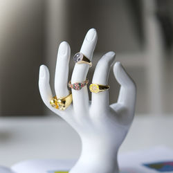 Close-up of human hand on white table
