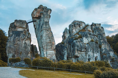 Low angle view of rock formation against sky