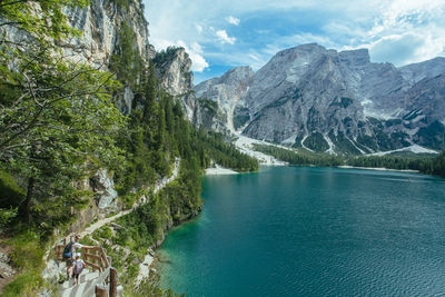 Scenic view of lake and mountains against sky