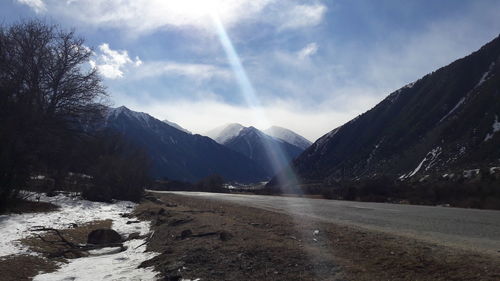 Scenic view of mountains against sky during winter