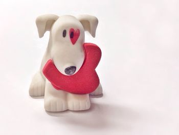 Close-up of figurine on white background