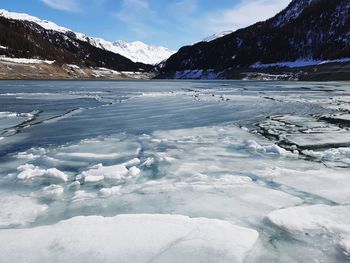 Scenic view of frozen lake against mountains