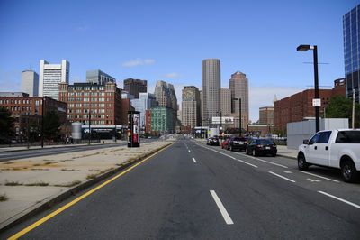 City street and modern buildings against sky