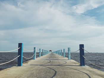 Pier over sea against sky