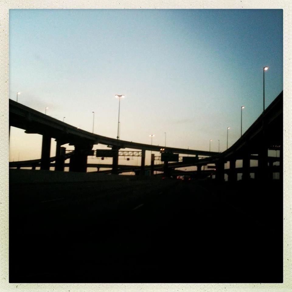 transportation, built structure, bridge - man made structure, architecture, connection, sky, bridge, transfer print, silhouette, clear sky, railing, sunset, engineering, street light, auto post production filter, copy space, the way forward, dusk, long, railroad station