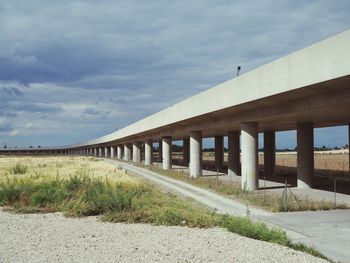 View of bridge on field against sky