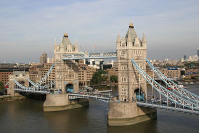 Tower bridge over thames river against sky