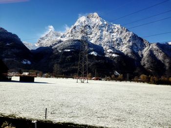 Scenic view of snowcapped mountains against clear sky