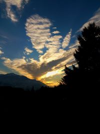 Low angle view of silhouette mountain against sky during sunset