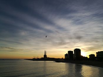 Silhouette of city at sunset